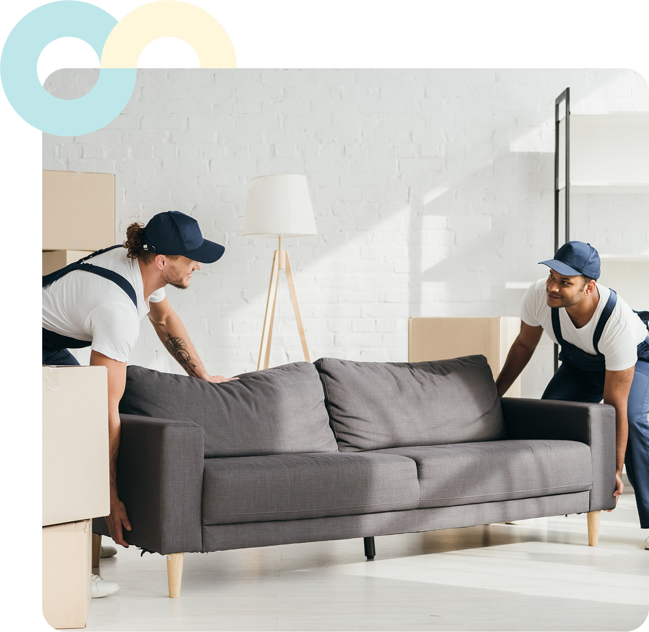 Two movers carrying a sofa