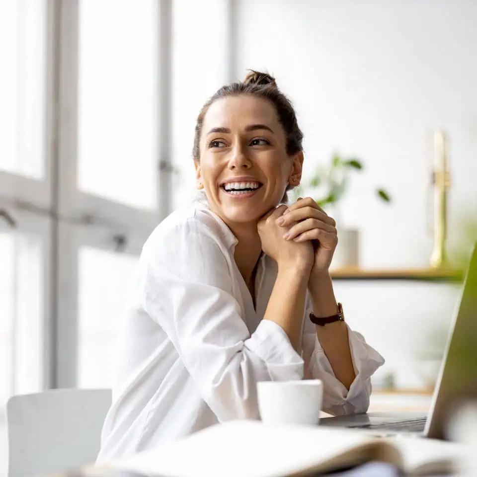 smiling woman at a desk