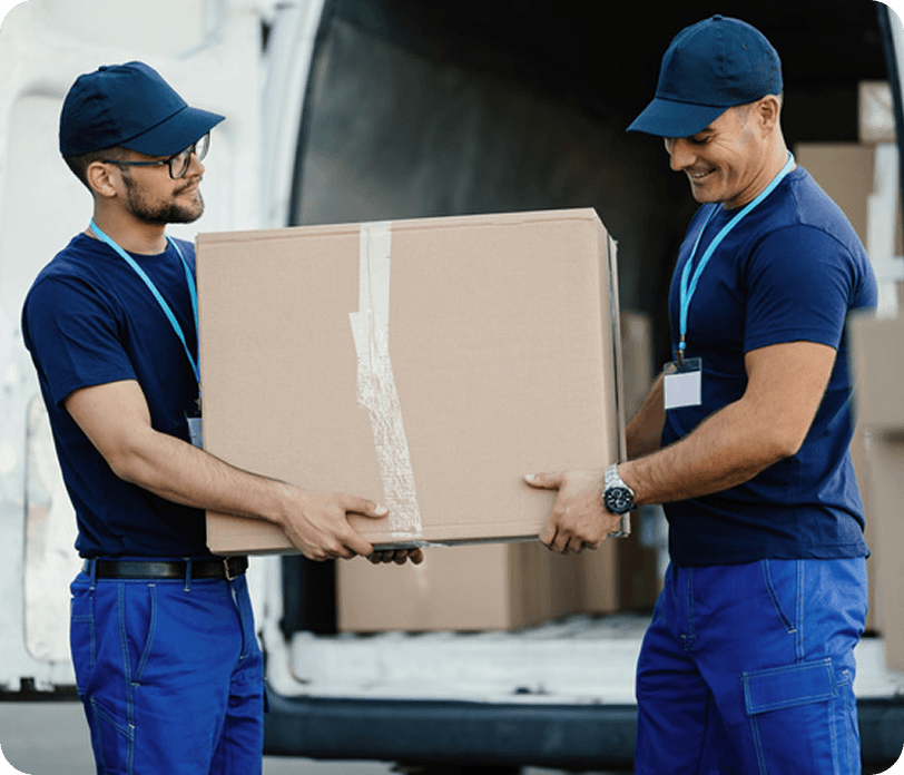 two guys picking up a box