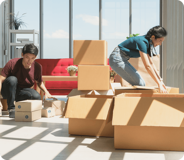 two persons packing up the boxes