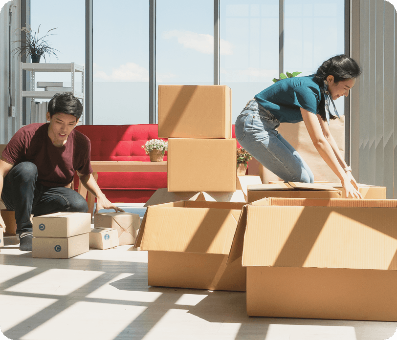 two people picking up couch