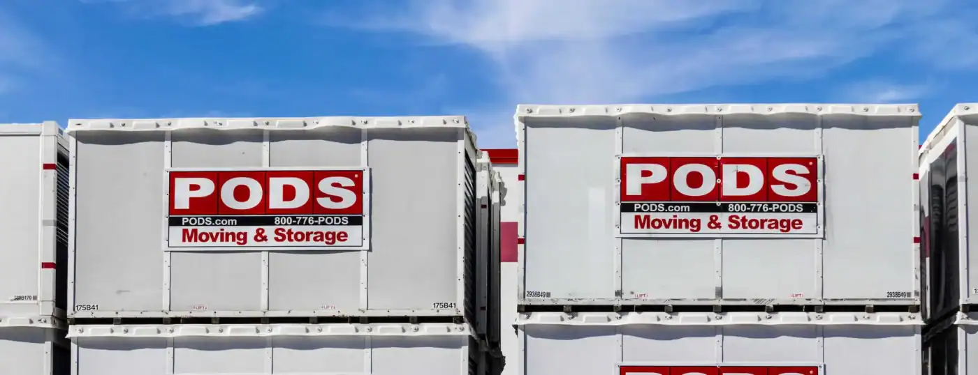 PODS moving and storage containers stacked outdoors for moving